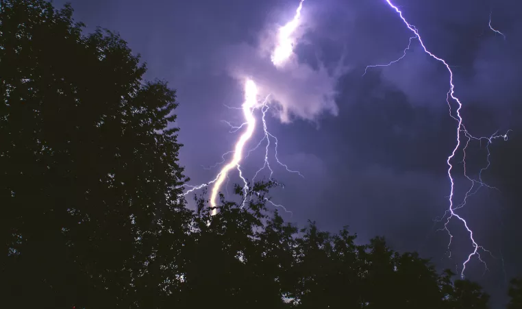 lightning strike on forest at night