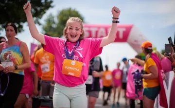 A GOTR runner celebrating her 5K finish